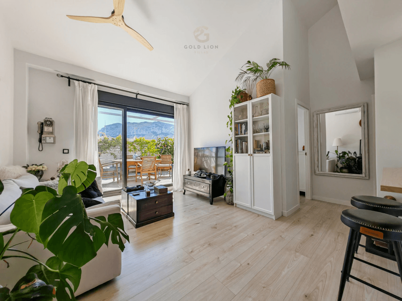 Penthouse for sale with a south orientation and unobstructed views of the park and the mountains.