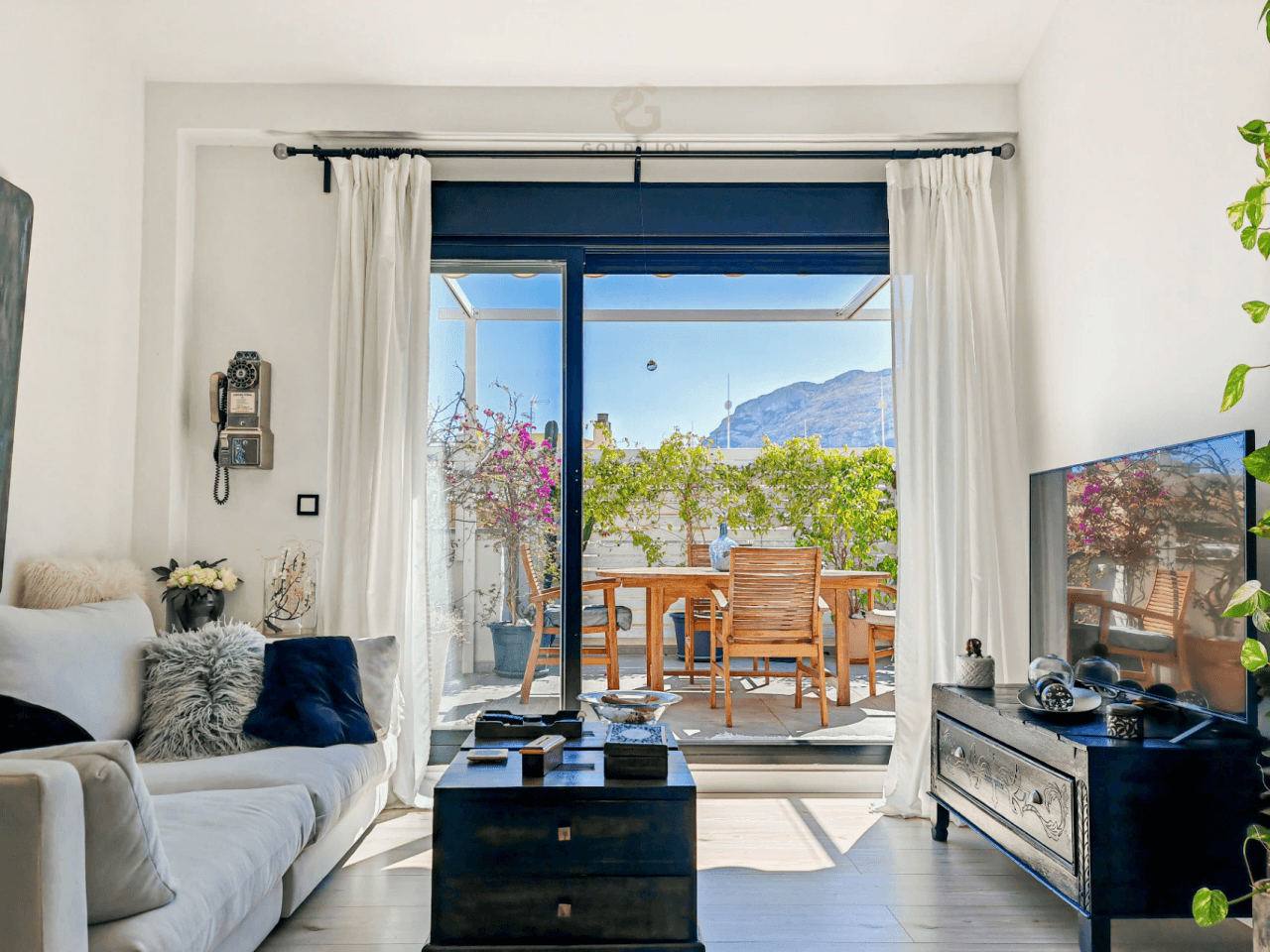Penthouse for sale with a south orientation and unobstructed views of the park and the mountains.